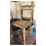 Antique oak child's seat with cane bottom