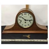 Mantel clock with key.