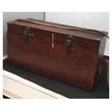 Wooden box with leather carrying strap.