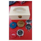 4 pocket measuring tapes a compass and a wood box