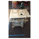 Antique cast iron Goodwill 4-burner gas stove.