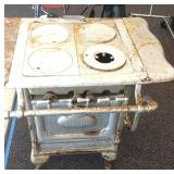 Antique cast iron Goodwill 4-burner gas stove.