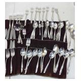 Silverplate flatware. 58 pieces and carrier.