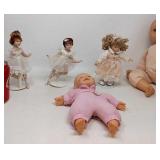 3 Porcelain dolls on stands,