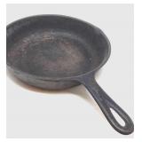 Antique cast iron skillet marked 7 C on bottom.