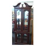 Solid cherry lighted china cabinet. Glass shelves.