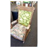 Antique Eastlake style rocking chair on wheels.