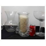 3 Clear glass vases, one is full of beads,