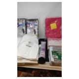 Box lot, new tablecloths, pot holder, storage