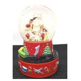 Coca-Cola Santa musical snow globe with train.