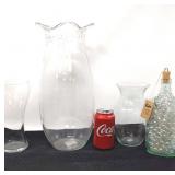 3 clear vases, 1 decorative bottle of marbles.