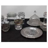 Assorted glassware, decorative metal plates,