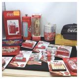 Coca-Cola collectibles, bank, straw holder, cap,