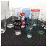 14 Coca-Cola glasses. Different styles and sizes.