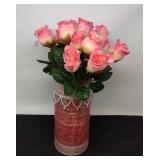 Glass vase with pink frosted roses.