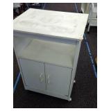 Microwave cabinet on wheels. Approximately