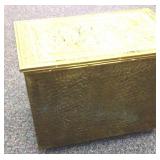 Gold finished kindling box on wheels.