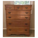 One maple chest of drawers. Measures