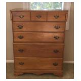 One maple chest of drawers. Measures