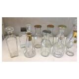 10 Glass bottles with stoppers and/or lids.