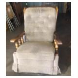 Upholstered and wood trim rocker/recliner.