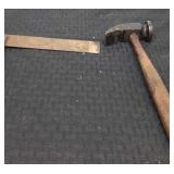 Antique carpenter square and small slag hammer.