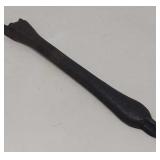 Antique cast iron stove grate handle.