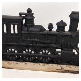 Wrought iron locomotive door stop.