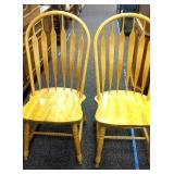 2 Wooden dining room chairs.