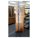 Black metal coat rack. Approximately 75" tall.