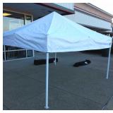 E-Z up instant shelter. Approximately 10'x10'.