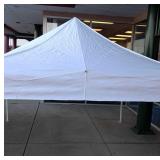E-Z up instant shelter. Approximately 10'x10'.