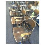 8 Matching vintage wooden armed chairs.