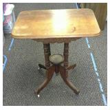 Very unique antique table on porcelain casters.