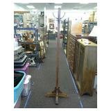 Wooden coat rack.  Approximately 6' tall.