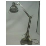 Brushed stainless finish adjustable reading lamp.