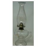 Vintage oil lamp. Base has handle.