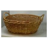 Oval woven basket. Approximately 18'x21'x8'.
