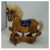 Pull tiy horse on wheels.