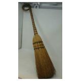 Decorative broom. Approximately 35" long.