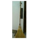 Decorative broom with 2 brooms. Approximately 56"