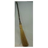 Decorative broom approximately 32' long.