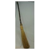 Decorative broom approximately 32" long.