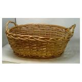 Oval woven basket. Approximately 18"x21"x8".