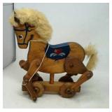 Pull toy horse on wheels.