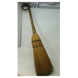 Decorative broom. Approximately 35" long.