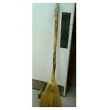 Decorative broom approximately 51" long.