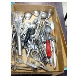 Assorted kitchen utensils and flatware.