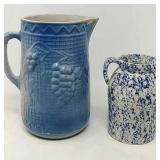 Vintage 9" tall stoneware blue pitcher has crack