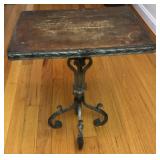 Small wrought iron table with a wood top